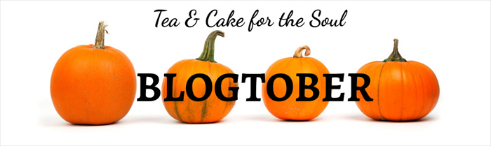 photo of 4 orange pumpkins on a white background with the text tea and cake for the soul BLOGTOBER