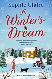 book cover for A Winters Dream by Sophie Claire with images of a man pulling a wheely on a motorbike and a woman walking a black Labrador in the snow